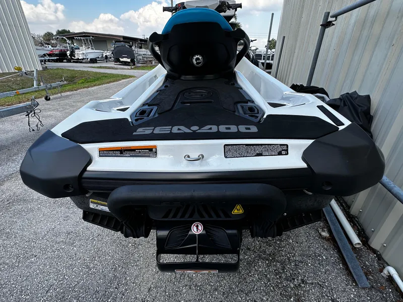 Slide: The Image of 2023 Sea-Doo Fish Pro Scout jet ski, rear view, parked outdoors. - 5