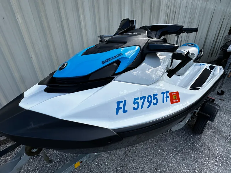 Slide: The Image of 2023 Sea-Doo Fish Pro Scout jet ski with blue accents on a trailer. - 7