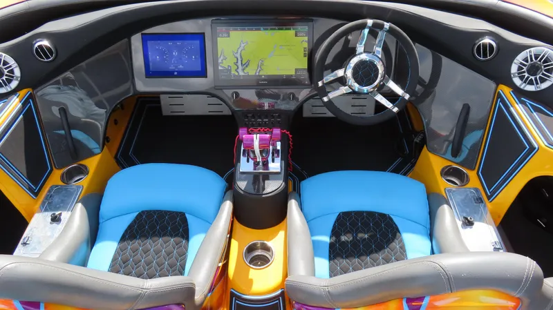 Slide: The Image of Vibrant MTI 48 R/P 2010 boat cockpit with dual screens and colorful seating. - 12