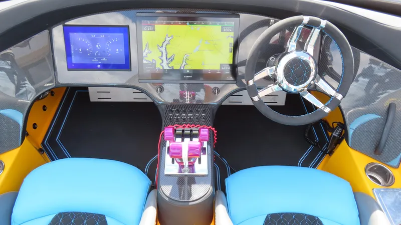 Slide: The Image of Cockpit of 2010 MTI 48 R/P boat with modern navigation screens and controls. - 13