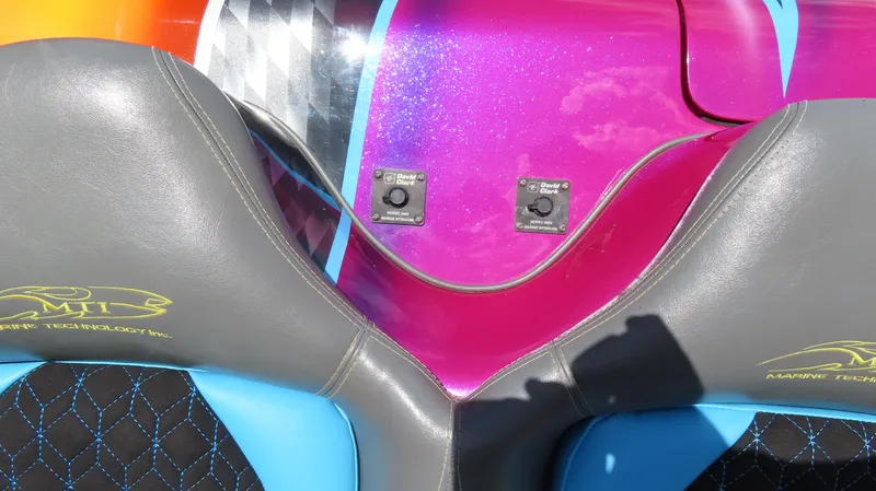 Slide: The Image of Colorful MTI 48 R/P boat interior with vibrant seats and control switches, 2010 model. - 17