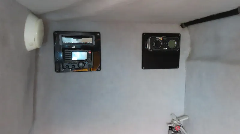 Slide: The Image of Interior of 2010 MTI 48 R/P boat with control panel and equipment. - 18