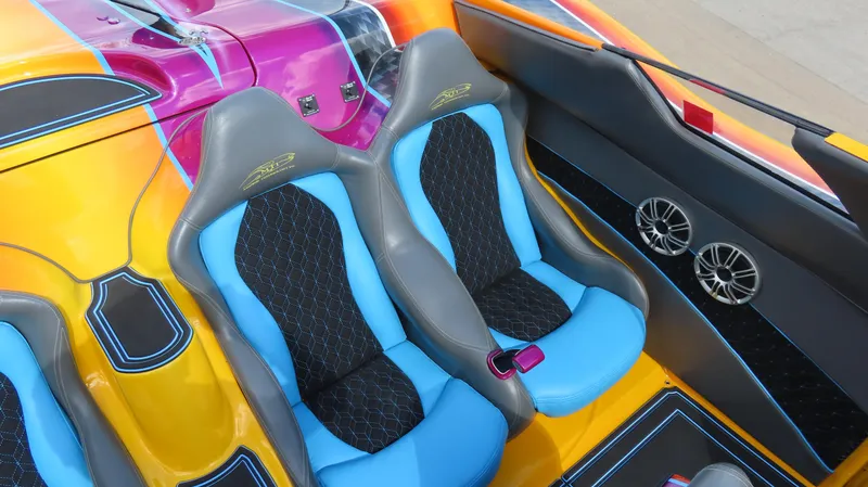 Slide: The Image of Vibrant MTI 48 R/P 2010 boat interior with colorful seats and sleek design. - 25