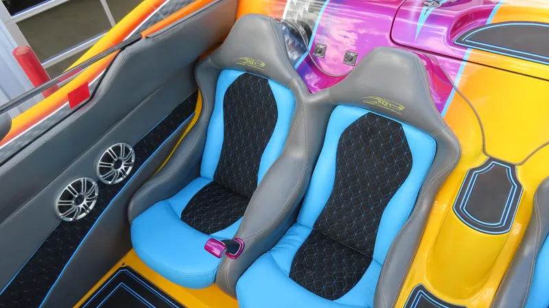 Slide: The Image of Vibrant interior of 2010 MTI 48 R/P boat with colorful seats and sleek design. - 26