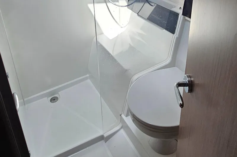 Slide: The Image of Bathroom interior of 2022 Beneteau Antares 11 with shower and toilet. - 19