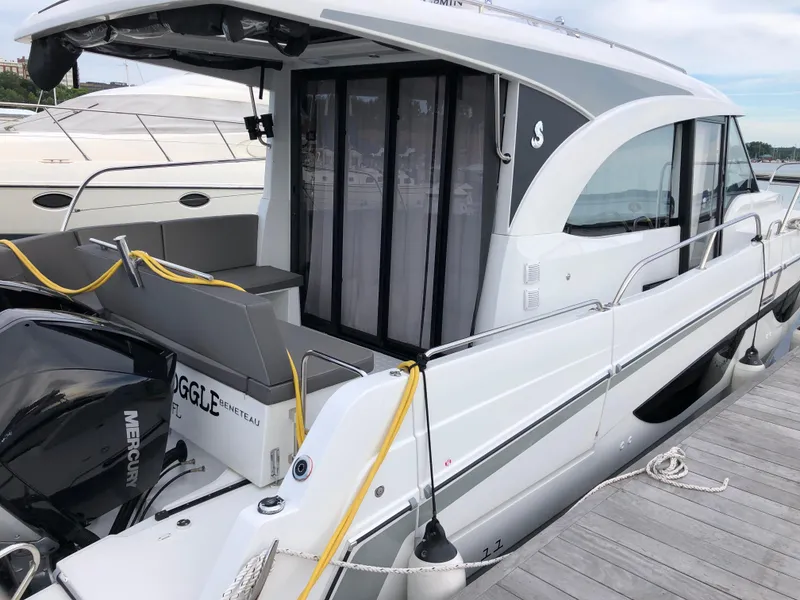 Slide: The Image of 2022 Beneteau Antares 11 docked, showcasing sleek design and modern features. - 4