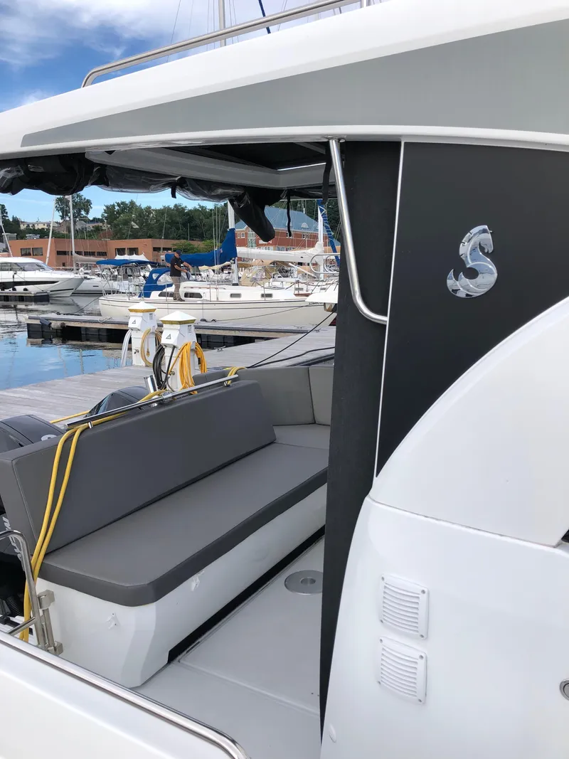 Slide: The Image of 2022 Beneteau Antares 11 boat with sleek design, docked at marina. - 6
