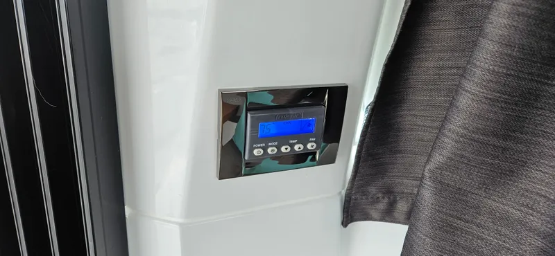 Slide: The Image of Control panel on 2022 Beneteau Antares 11 boat, featuring digital display and buttons. - 7