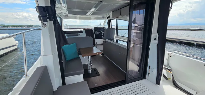 Slide: The Image of Interior view of 2022 Beneteau Antares 11 yacht with seating and table. - 9