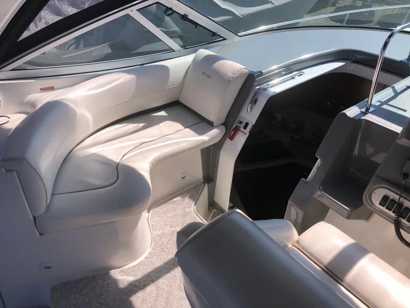 Slide: The Image of 2007 Cruisers Yachts 340 Express interior with white leather seating and modern design. - 18