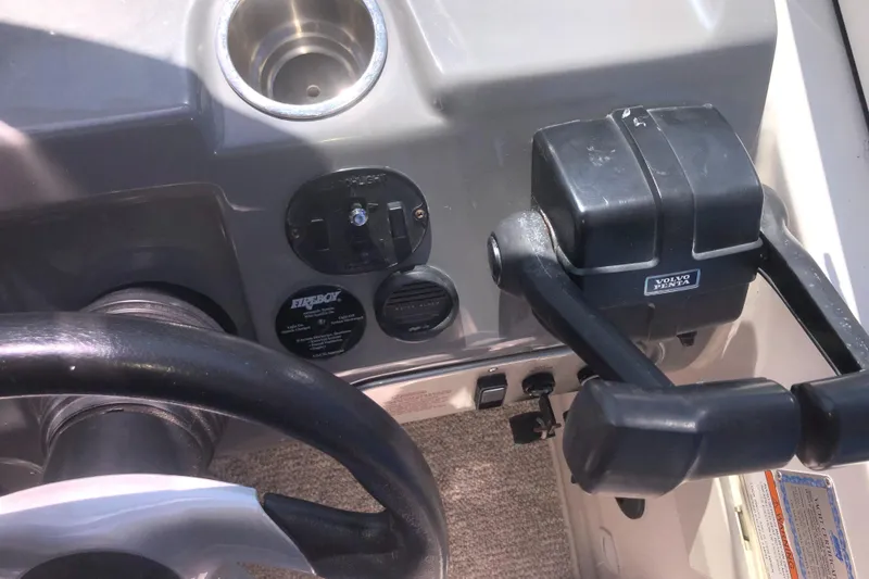 Slide: The Image of 2007 Cruisers Yachts 340 Express helm with steering wheel and throttle controls. - 22