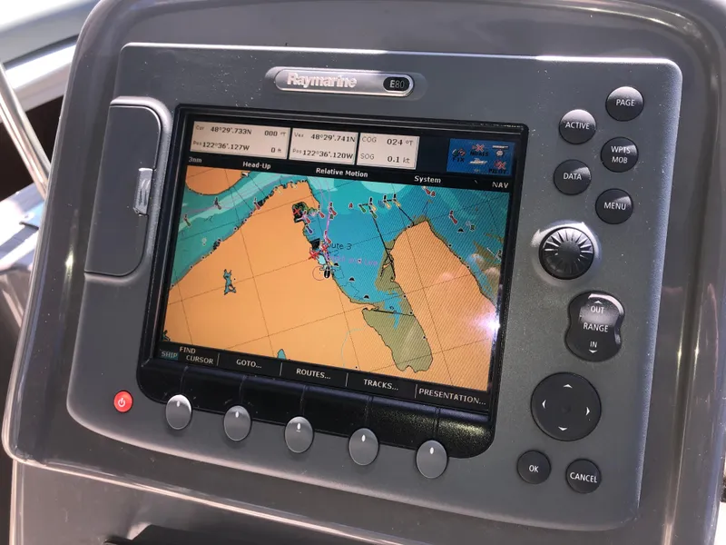 Slide: The Image of Raymarine navigation system on 2007 Cruisers Yachts 340 Express boat dashboard. - 24
