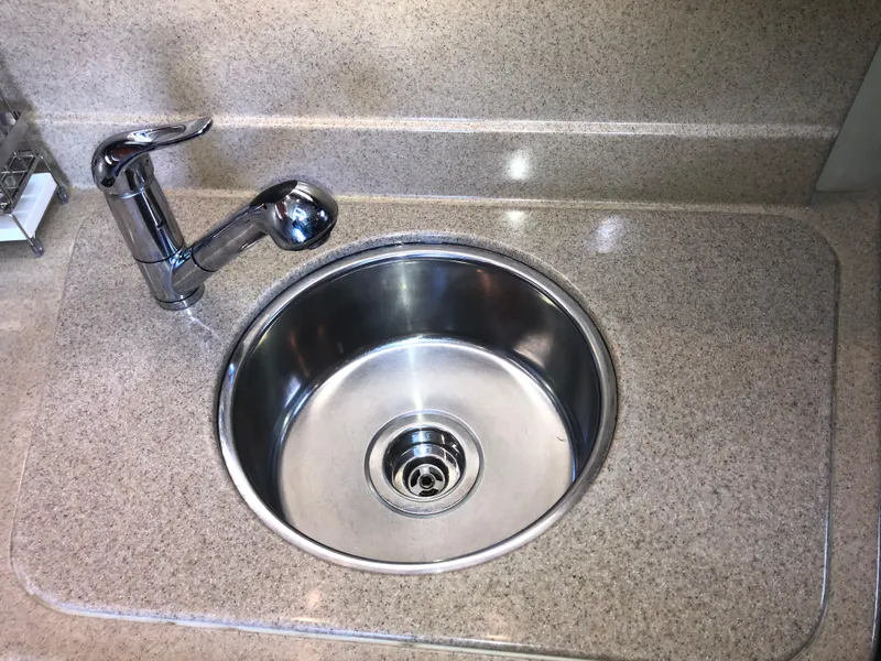 Slide: The Image of Stainless steel sink and faucet in 2007 Cruisers Yachts 340 Express kitchen. - 32