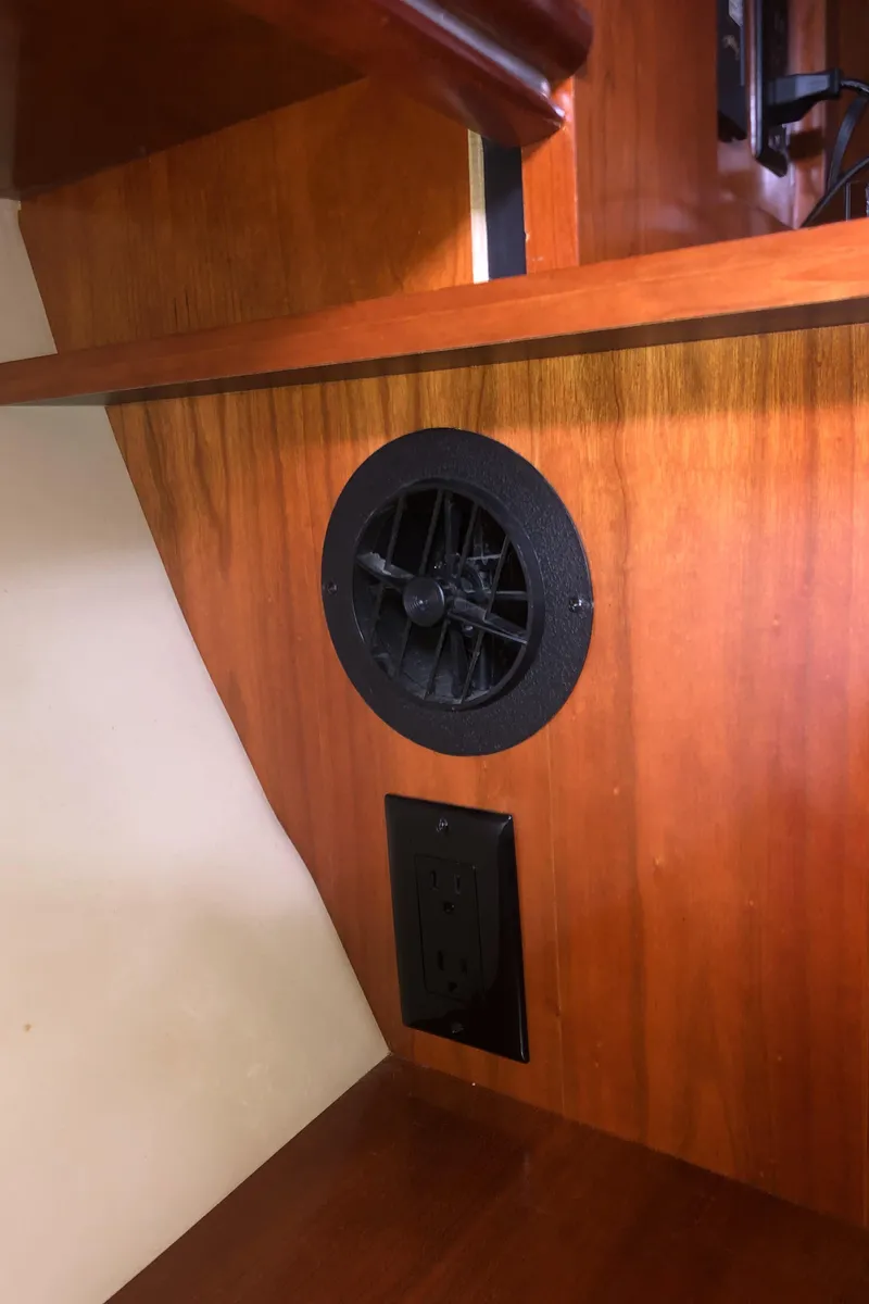 Slide: The Image of 2007 Cruisers Yachts 340 Express interior with wooden paneling and ventilation. - 46