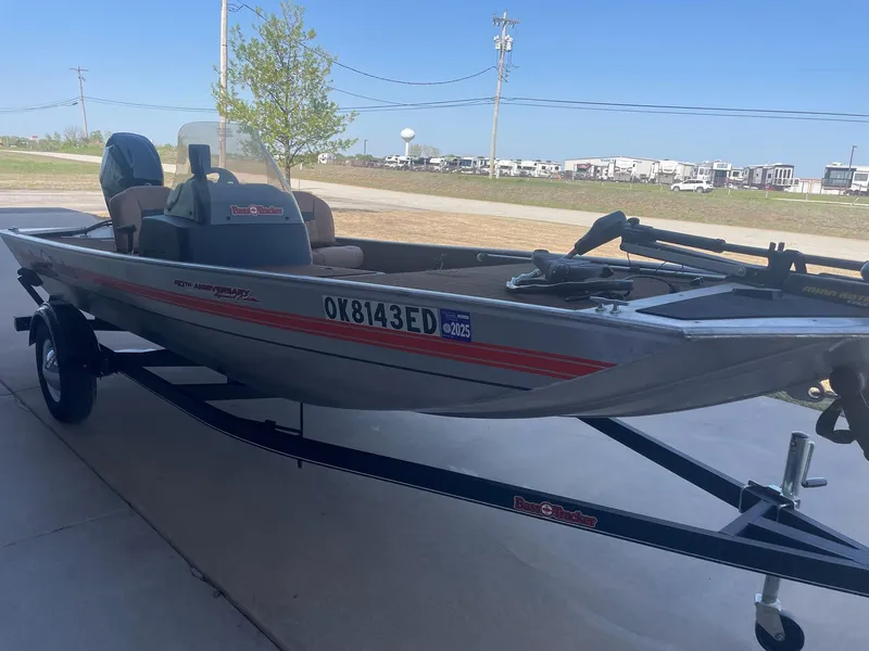 Slide: The Image of 2018 Bass Tracker Heritage boat on trailer, parked outdoors. - 4