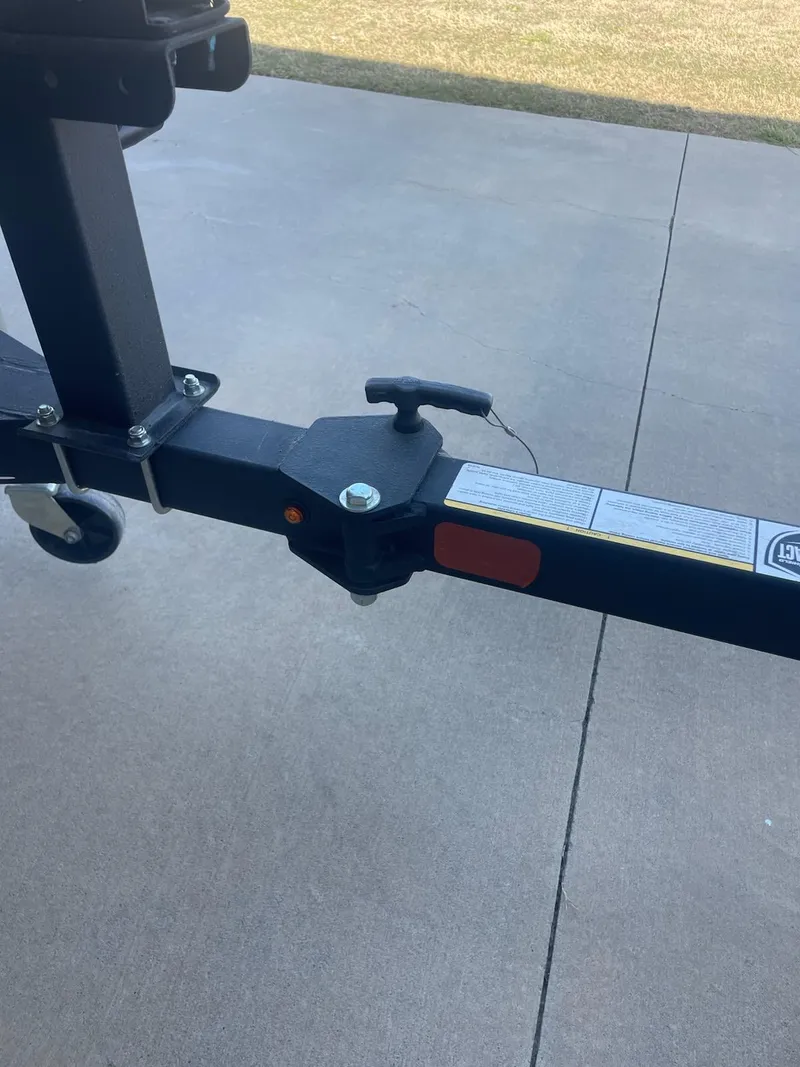 Slide: The Image of 2018 Bass Tracker Heritage trailer hitch on concrete driveway. - 5