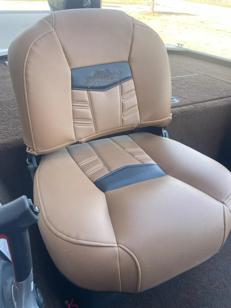 Slide: The Image of 2018 Bass Tracker Heritage boat seat with tan and black upholstery. - 6