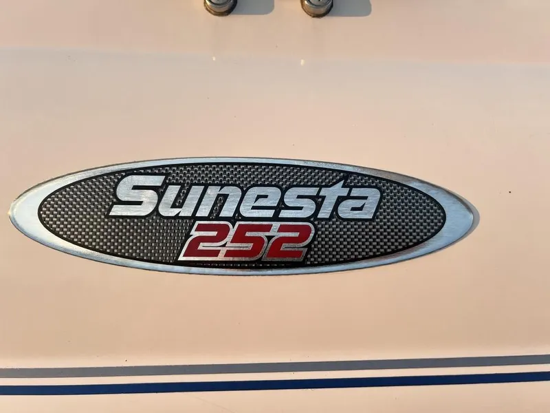 Slide: The Image of Chaparral Sunesta 252 logo on a 2000 model boat, featuring a sleek design. - 4