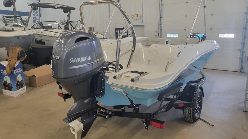 Slide: The Image of 2025 Hurricane SunDeck Sport 185 OB boat with Yamaha 115 engine in a showroom. - 7
