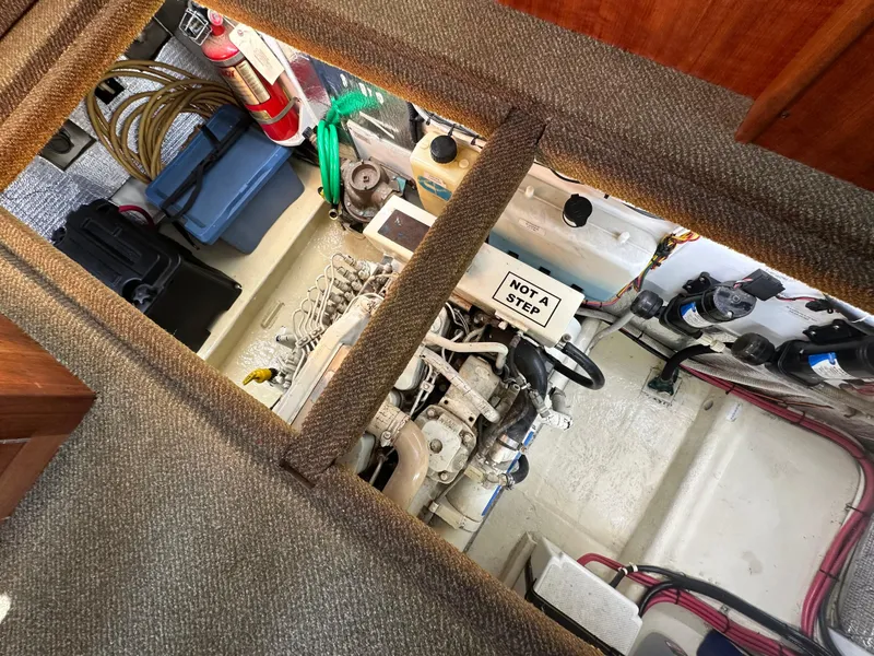 Slide: The Image of Engine compartment of a 2004 Nordic Tug 32, showing machinery and storage. - 5