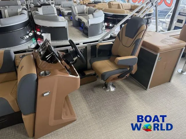 Slide: The Image of Interior of 2025 Tahoe Geofish 2385 boat with modern seating and control panel. - 11