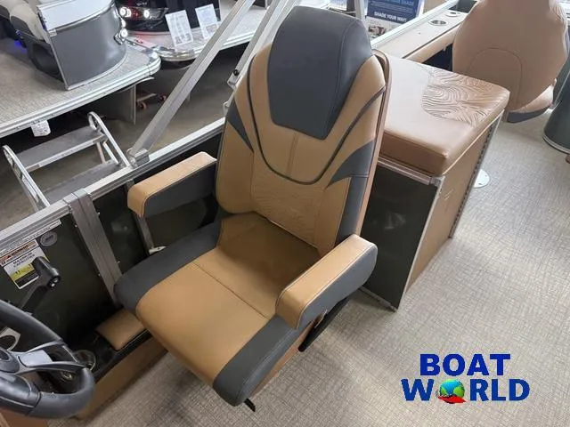 Slide: The Image of ```json
{
  "alt_text": "2025 Tahoe Geofish 2385 boat interior with tan and black captain's chair."
}
``` - 12