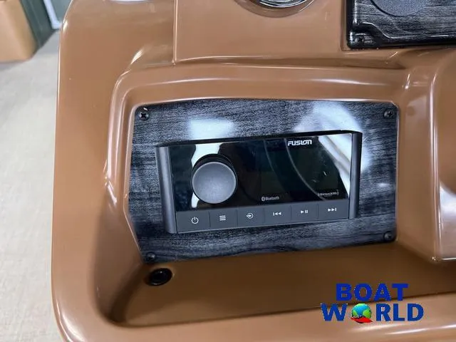 Slide: The Image of Control panel of 2025 Tahoe Geofish 2385 with Fusion Bluetooth audio system. - 14