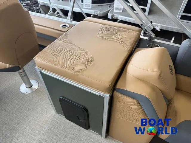 Slide: The Image of 2025 Tahoe Geofish 2385 boat interior with tan seating and storage, featuring Boat World logo. - 18