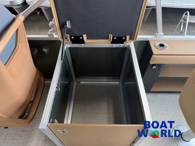 Slide: The Image of Open storage compartment on 2025 Tahoe Geofish 2385 boat, featuring tan interior and Boat World logo. - 22