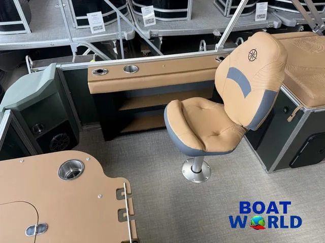 Slide: The Image of 2025 Tahoe Geofish 2385 boat interior with tan seating and fishing setup. - 23