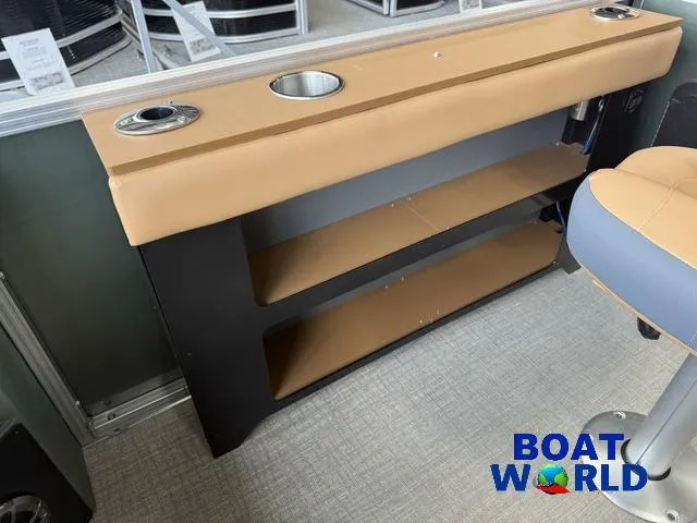 Slide: The Image of Interior of 2025 Tahoe Geofish 2385 with storage shelves and cup holders. - 24