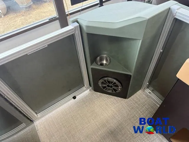 Slide: The Image of 2025 Tahoe Geofish 2385 interior with speaker and cup holder, Boat World branding. - 25