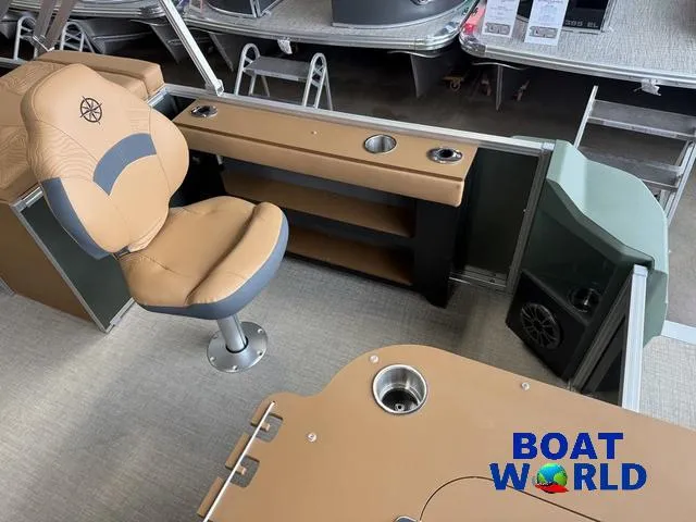 Slide: The Image of 2025 Tahoe Geofish 2385 boat interior with tan seating and fishing station. - 28