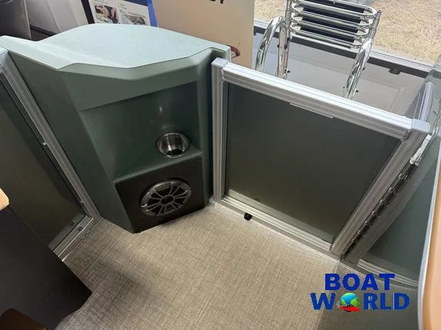 Slide: The Image of Interior of 2025 Tahoe Geofish 2385 boat with speaker and cup holder, Boat World logo. - 30