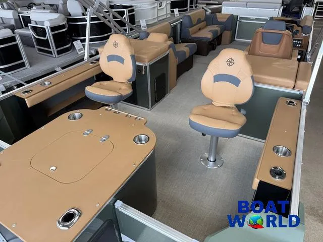 Slide: The Image of 2025 Tahoe Geofish 2385 boat interior with tan seating and fishing amenities at Boat World. - 31