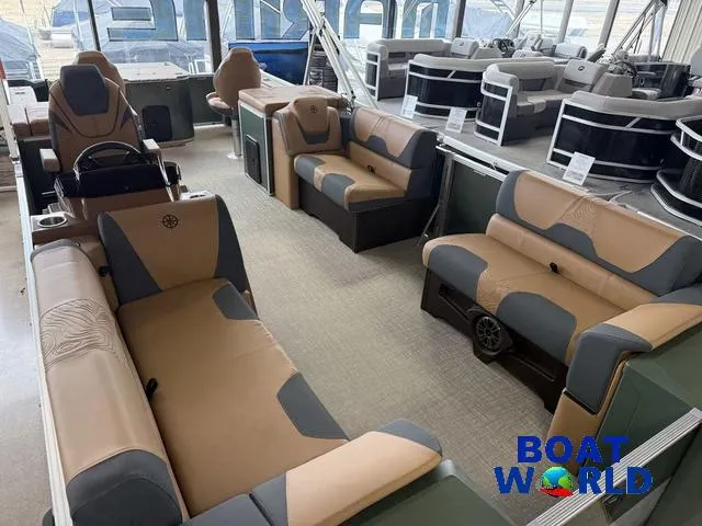 Slide: The Image of 2025 Tahoe Geofish 2385 boat interior with tan and gray seating, showcased at Boat World. - 36