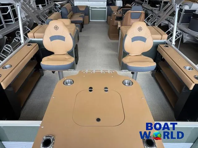 Slide: The Image of 2025 Tahoe Geofish 2385 boat interior with tan seating and fishing setup. - 6