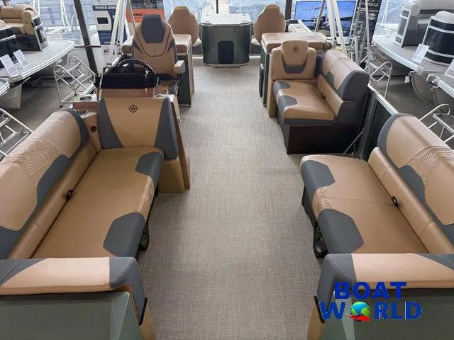 Slide: The Image of 2025 Tahoe Geofish 2385 boat interior with tan and gray seating, showcased at Boat World. - 7