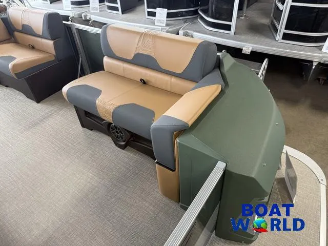 Slide: The Image of 2025 Tahoe Geofish 2385 boat interior with tan and gray seating at Boat World showroom. - 9