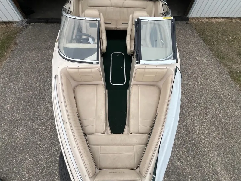 Slide: The Image of 1995 Celebrity 180 Bowrider boat with beige interior, viewed from above. - 11