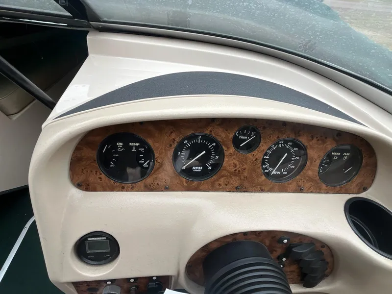 Slide: The Image of Dashboard of a 1995 Celebrity 180 Bowrider boat with gauges and controls. - 9