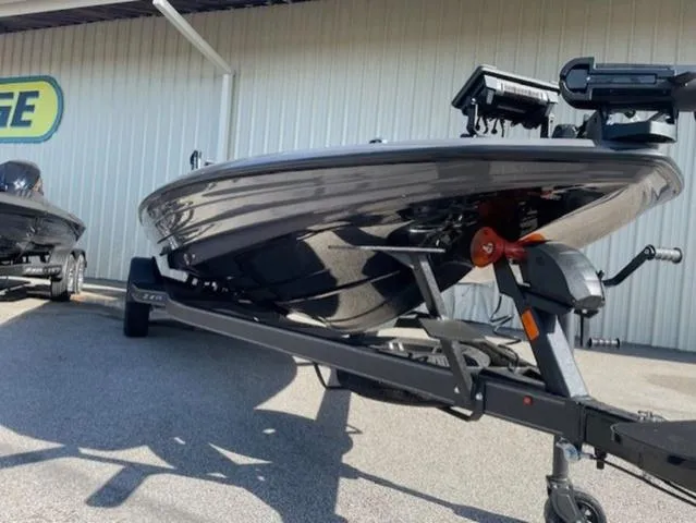 Slide: The Image of 2025 Skeeter ZXR21 boat on trailer, parked outdoors, showcasing sleek design and modern features. - 4