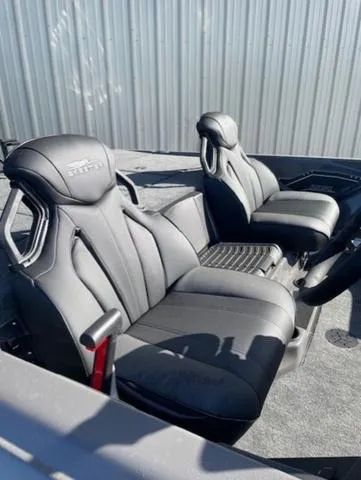 Slide: The Image of 2025 Skeeter ZXR21 boat interior with sleek black seats and modern design. - 9