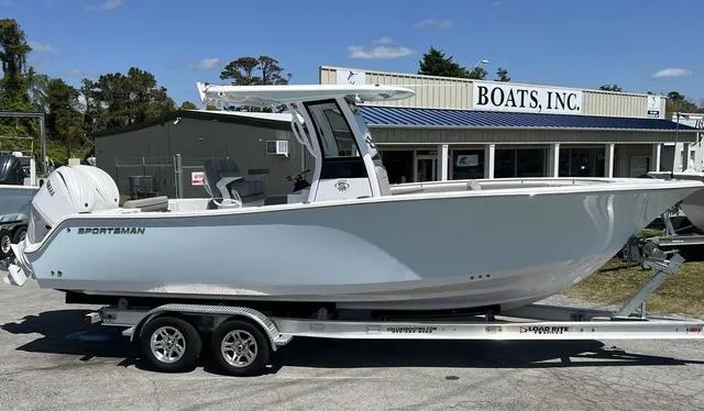 Slide: The Image of 2025 Sportsman Open 252 boat on trailer outside Boats, Inc. dealership. - 1