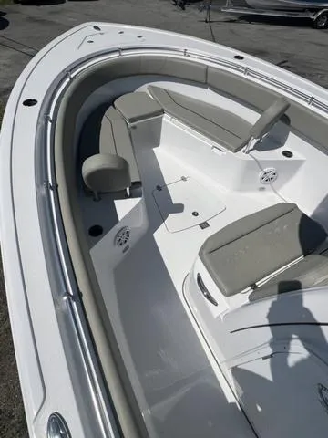 Slide: The Image of 2025 Sportsman Open 252 boat interior with cushioned seating and sleek design. - 12