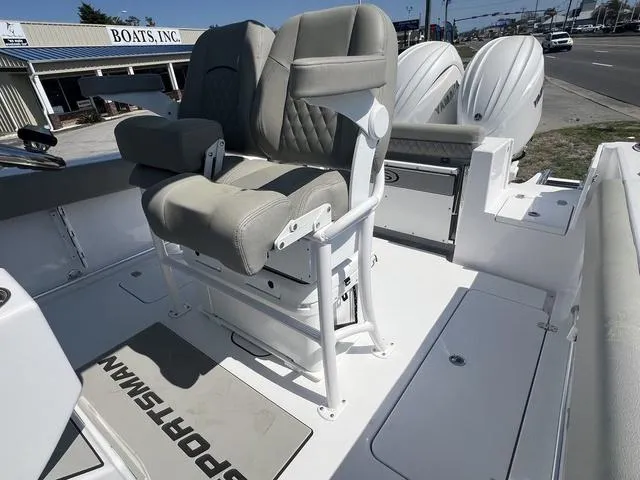 Slide: The Image of 2025 Sportsman Open 252 boat interior with dual seats and twin engines. - 13