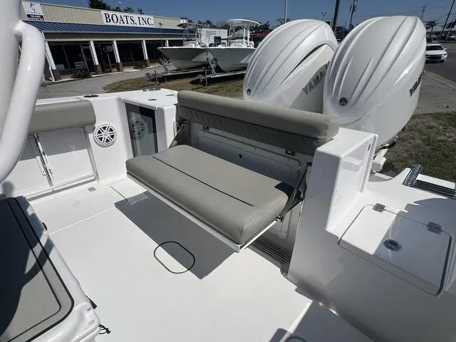 Slide: The Image of 2025 Sportsman Open 252 boat with dual engines and foldable seating. - 14