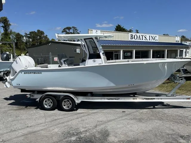 Slide: The Image of 2025 Sportsman Open 252 boat on trailer outside Boats, Inc. dealership. - 16