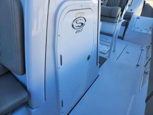 Slide: The Image of 2025 Sportsman Open 252 boat interior, featuring seating and storage compartments. - 6