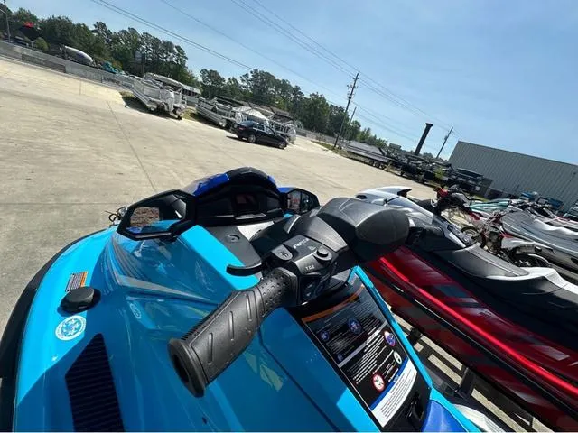 Slide: The Image of Two people on a 2025 Yamaha WaveRunner VX, enjoying a serene lake view. - 4